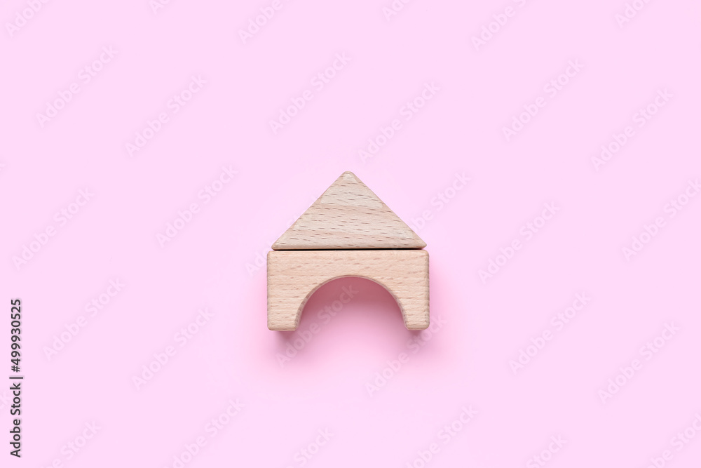 Wooden blocks on pink background