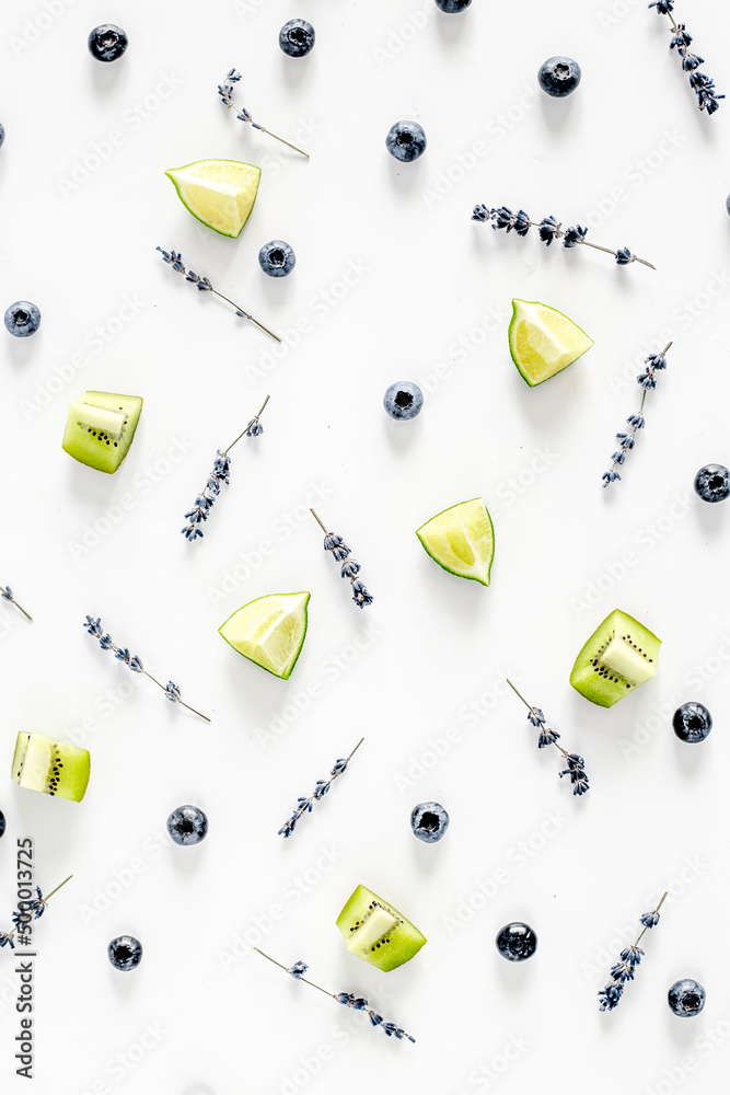 berry pattern with fruit and lavander on white desk background top view