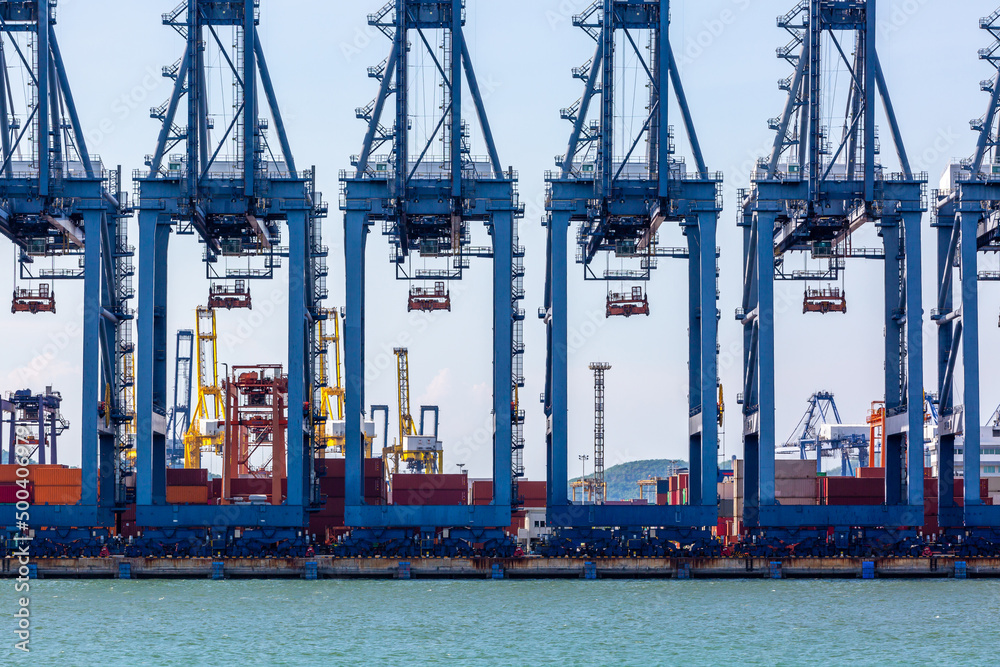 Industrial port crane lift up loading import export containers box onboard at deep sea port, Industr