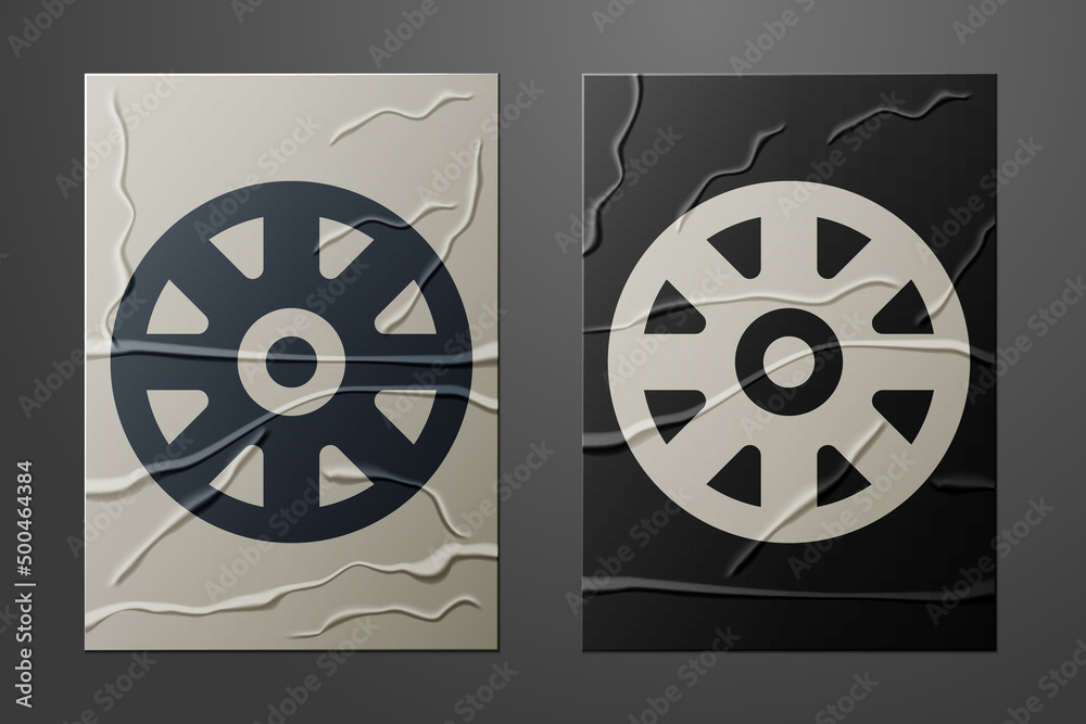 White Alloy wheel for car icon isolated on crumpled paper background. Paper art style. Vector