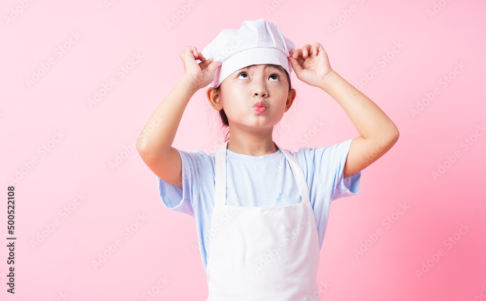 Image of Asian child practicing to be a chef