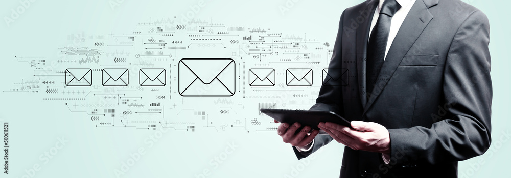 Email concept with businessman holding a tablet computer