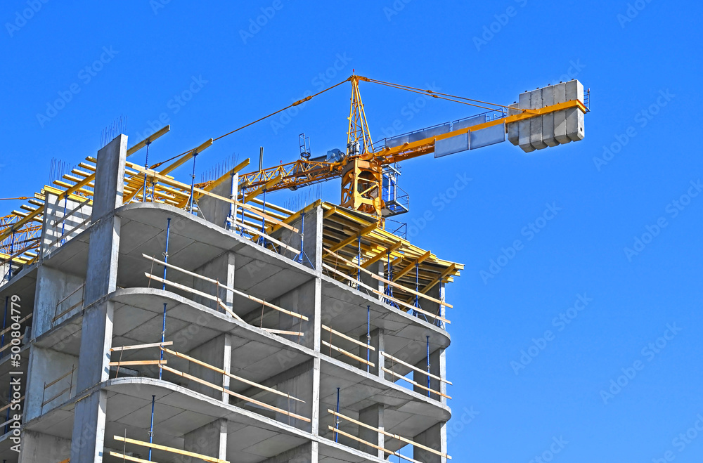 Crane and highrise construction site