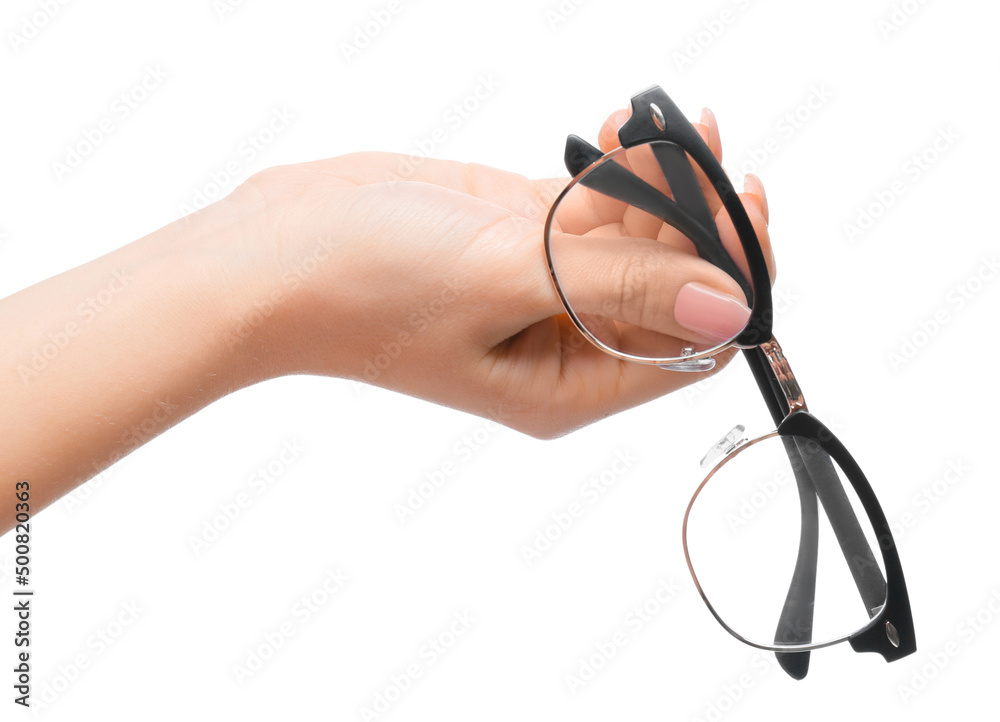 Female hand with new modern eyeglasses on white background