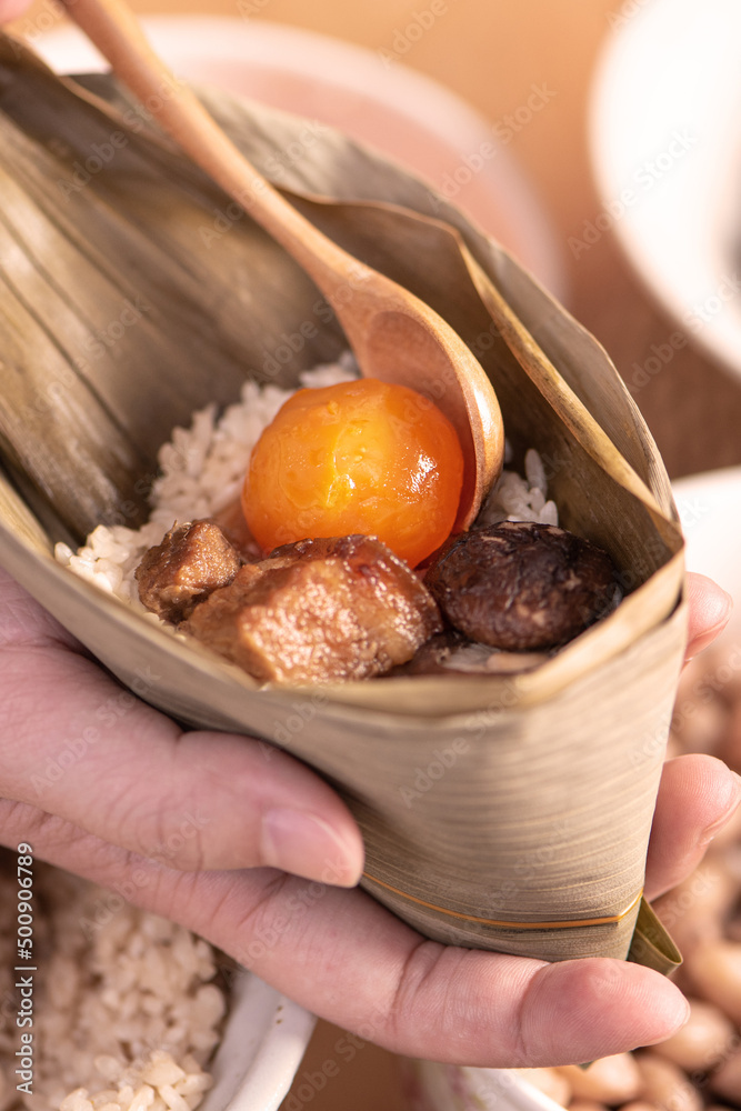 Making zongzi food - preparing and wrapping Chinese rice dumpling.