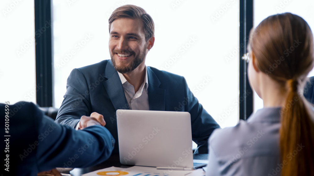 Handshake of successful people at a business meeting