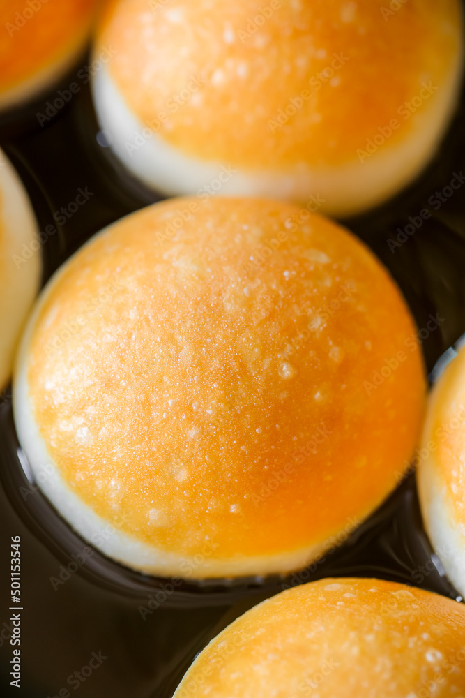 A round Japanese homemade doughnut or Bomboloni, sweet bakery fried with hot oil.