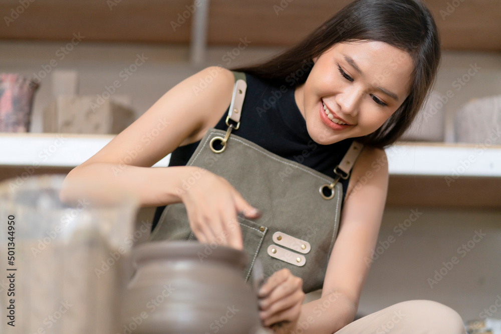 Close up of female hands working on potters wheel,asian female sculpture woman shaping mold small va