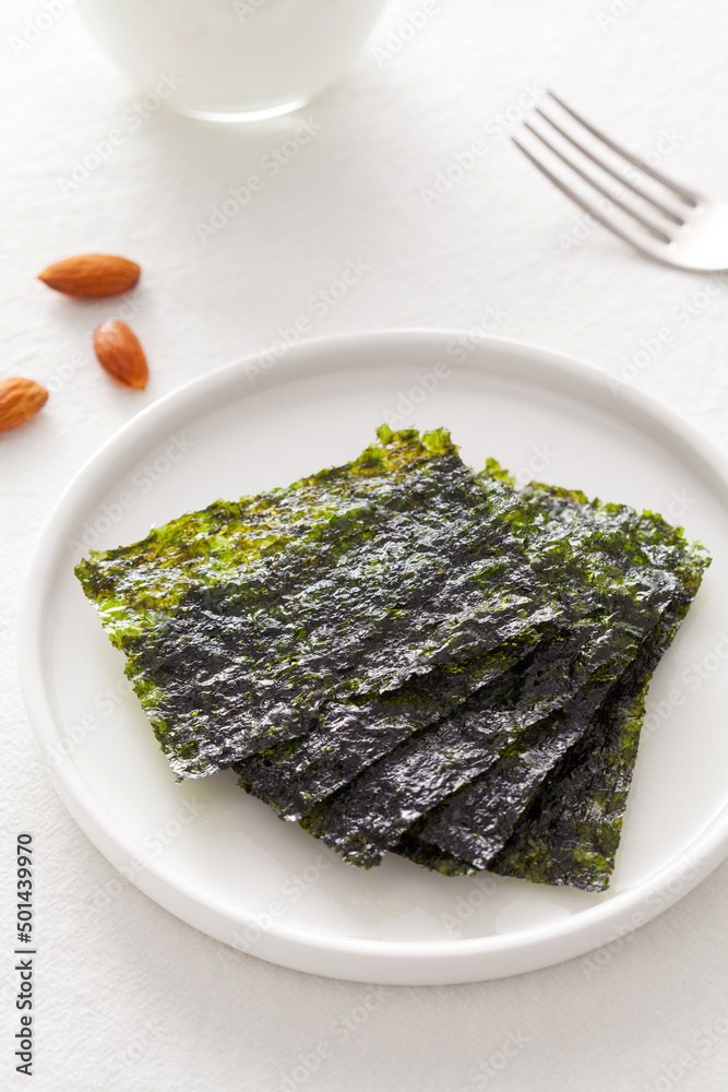 Set of nori sheets in a plate on white table.