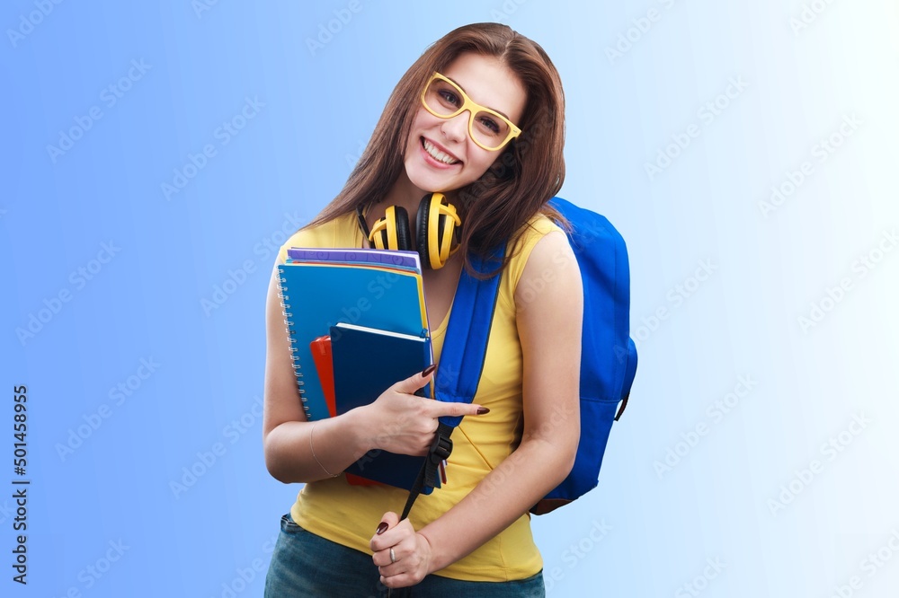 Smiling young student girl shows with books,  confident in her knowledge,  wearing shirt, white t-sh