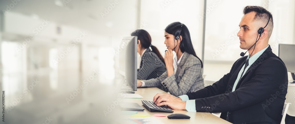 Business people wearing headset working in office to support remote customer or colleague. Call cent