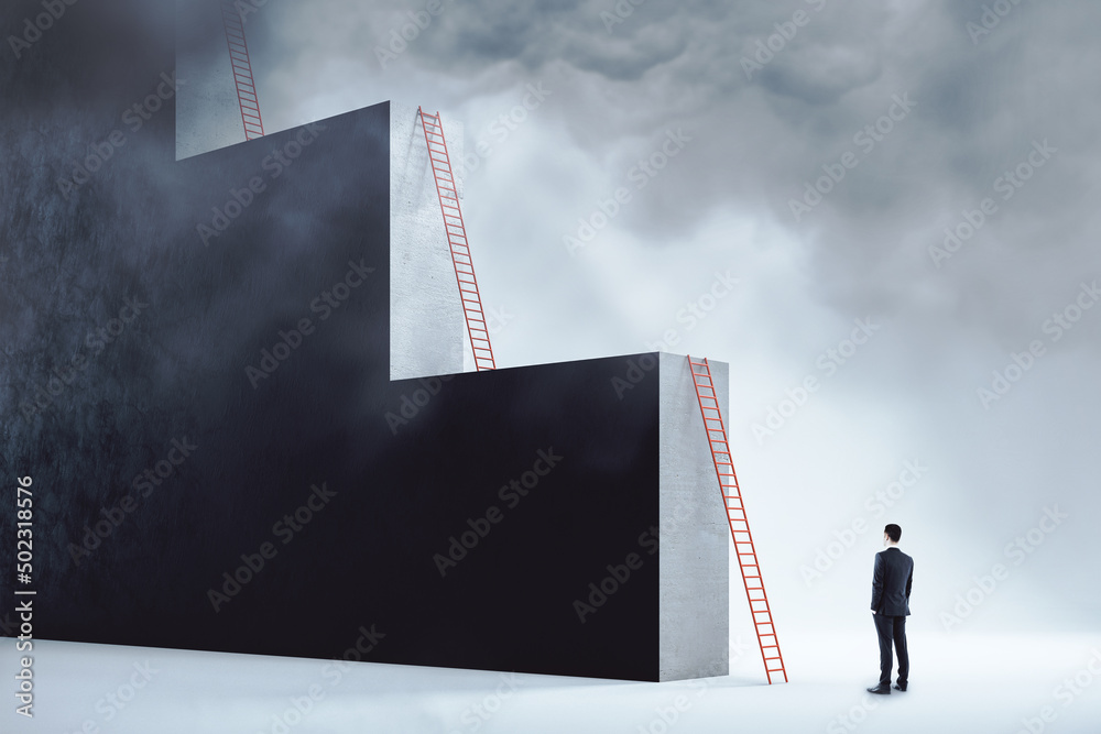 Ambition and career growth concept with man staying in front of red ladder leaning on a monumental w