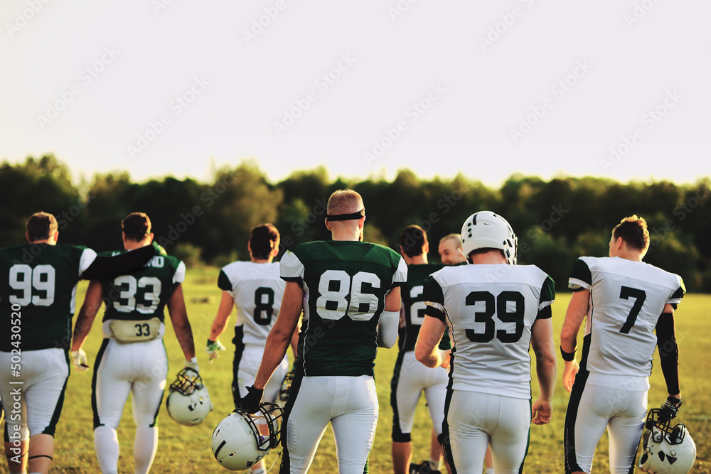 American football team walking on a field