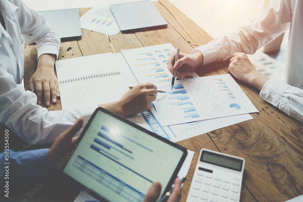 Teamwork with business people analysis cost graph on desk at meeting room, business team briefing pl