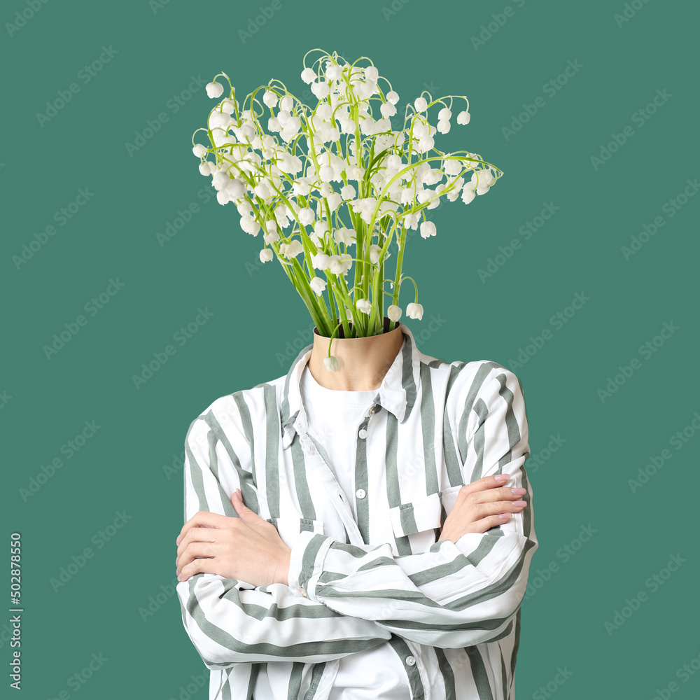 Woman with bouquet of beautiful lily-of-the-valley flowers instead of her head on green background