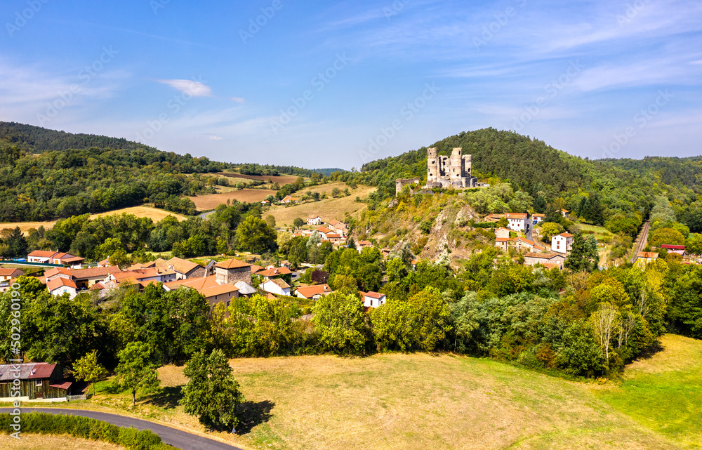 Aerial view of Domeyrat village with its castle in Auvergne, France