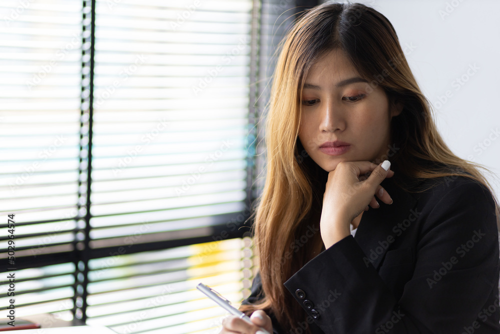 Business woman working in an office writes financial and accounting records. Accountant is working i