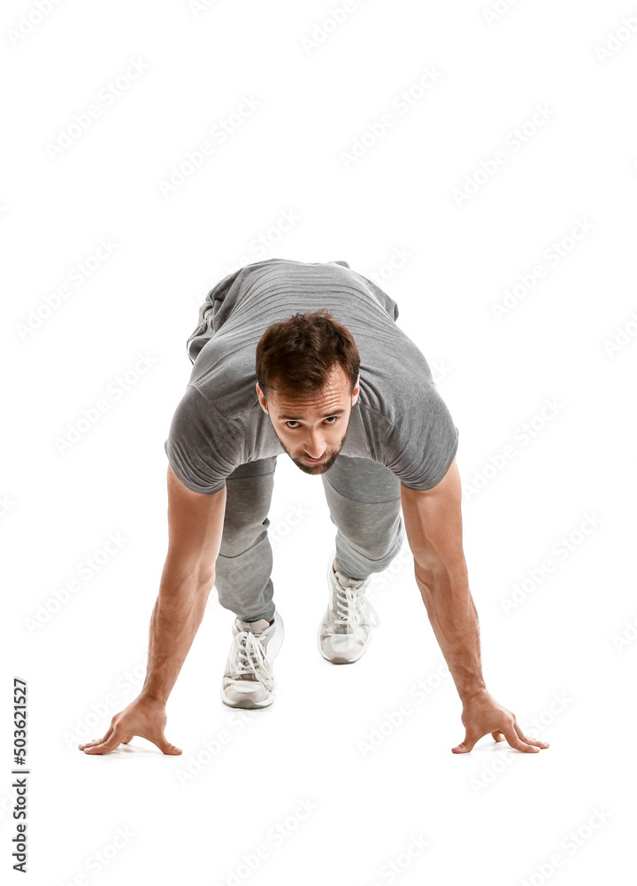 Sporty male runner on white background