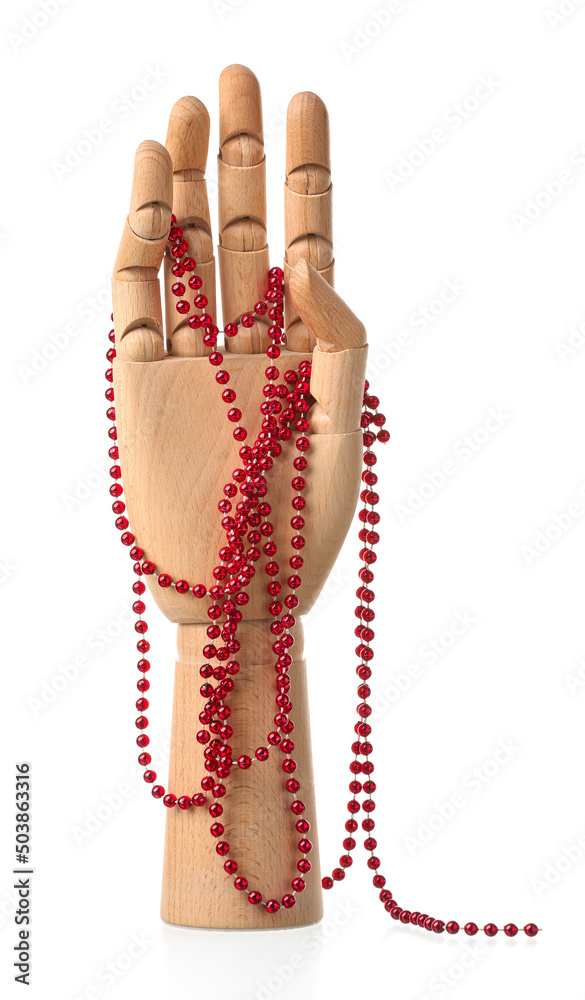 Wooden hand with red beads on white background