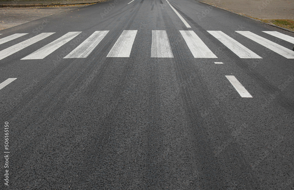 Zebra crosswalk on road in city