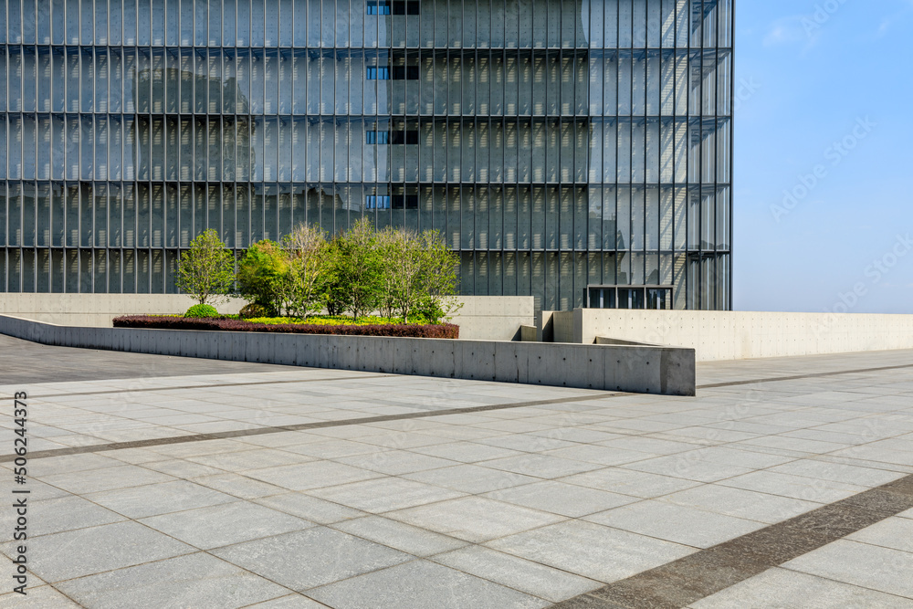 Empty square floor and modern commercial buildings in Shanghai, China.