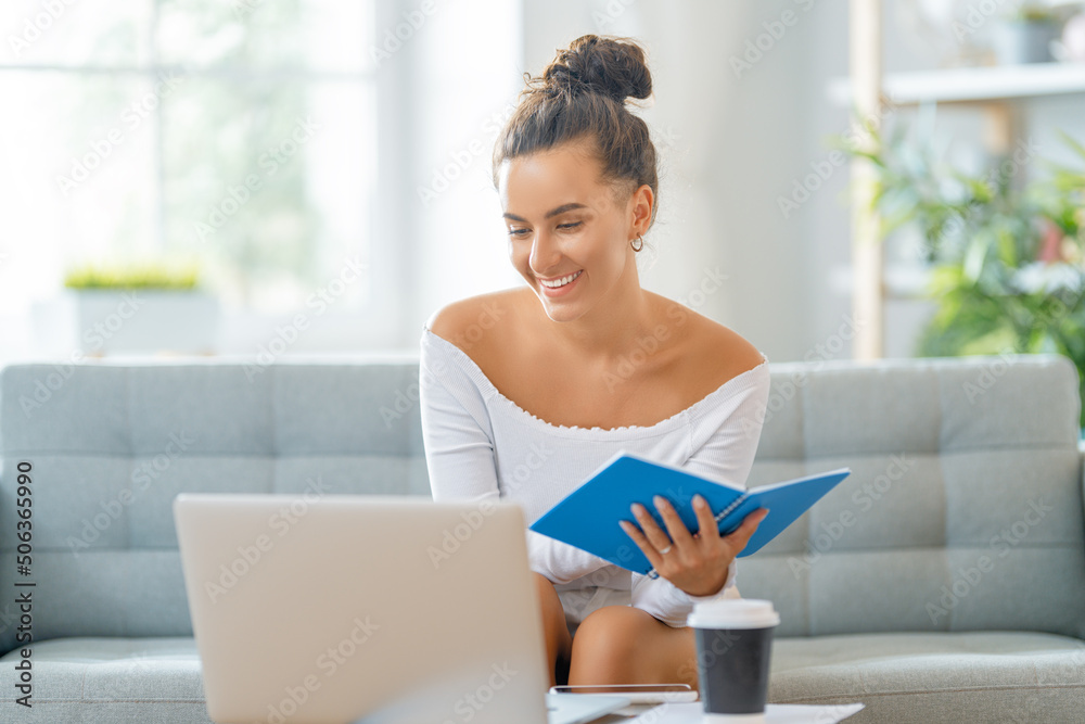 woman working on laptop at home.