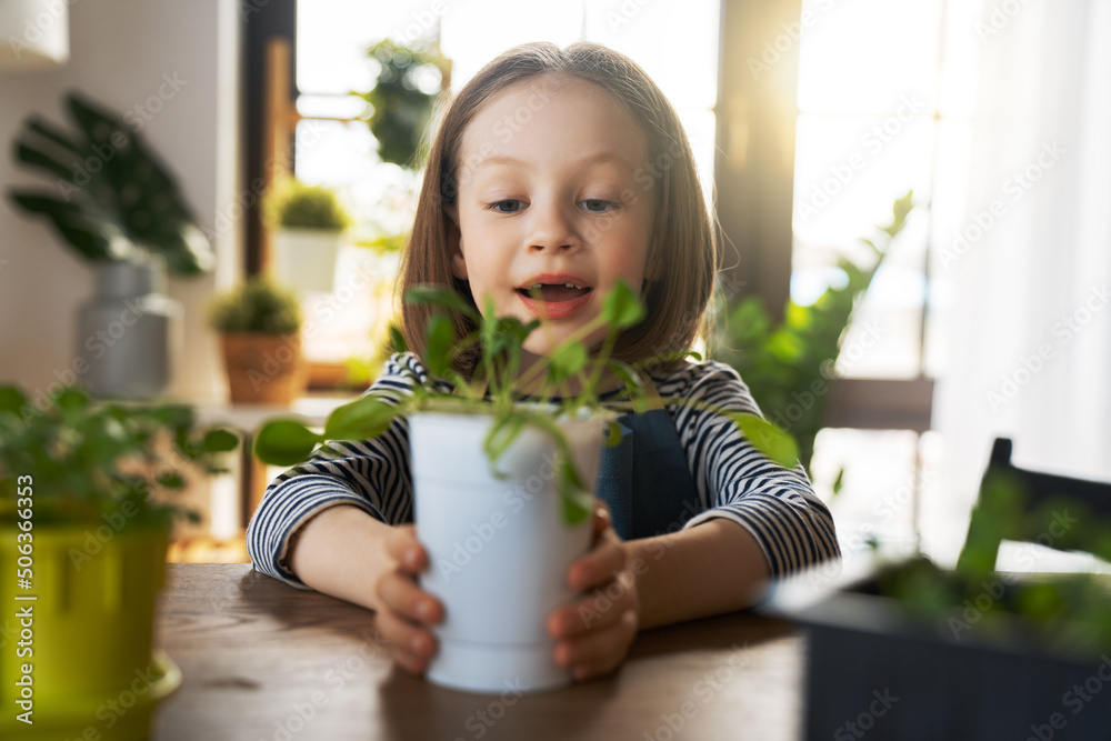 child is caring for plants