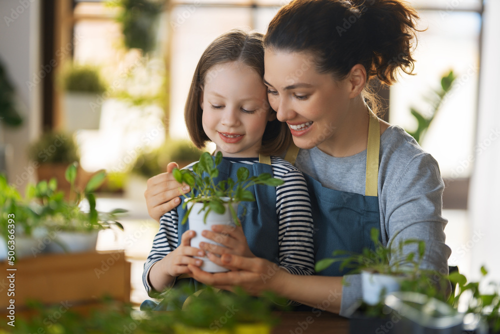 Family caring for plants