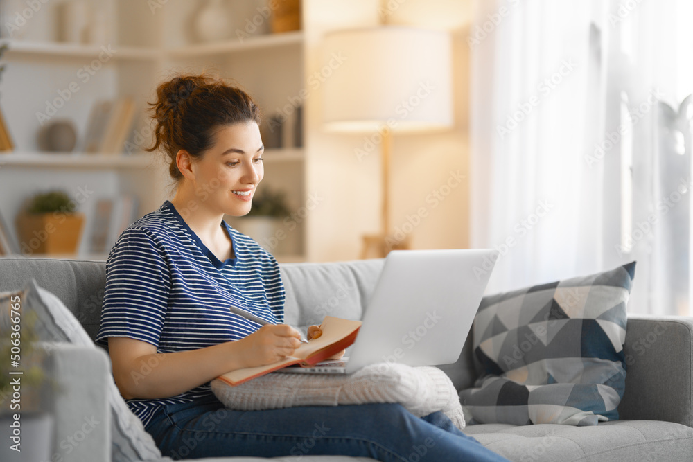 woman working on laptop at home