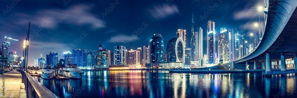 Skyscrapers city panorama of Dubai downtown with Burj Khalifa at night.