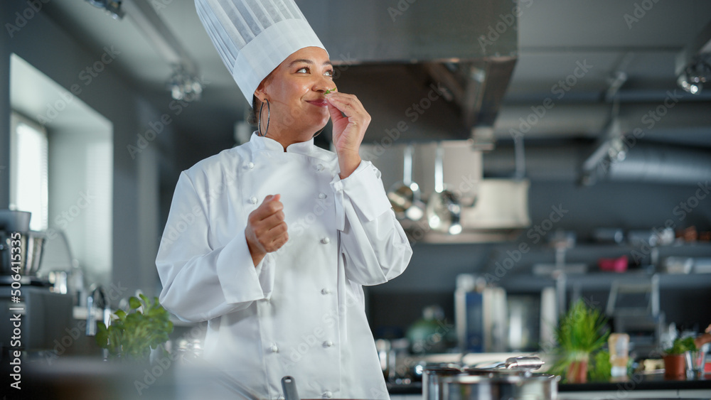 Restaurant Kitchen: Black Female Chef Fries Organic Patty on a Pan, Seasons it and Flips Cutlet with