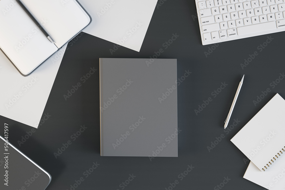 Top view of empty black notebook on black desktop with supplies. Work, diary, homework and workplace