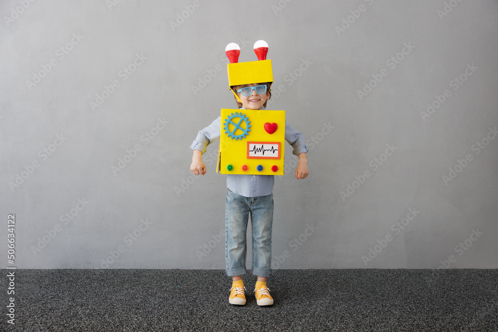 Happy child with robot have an idea