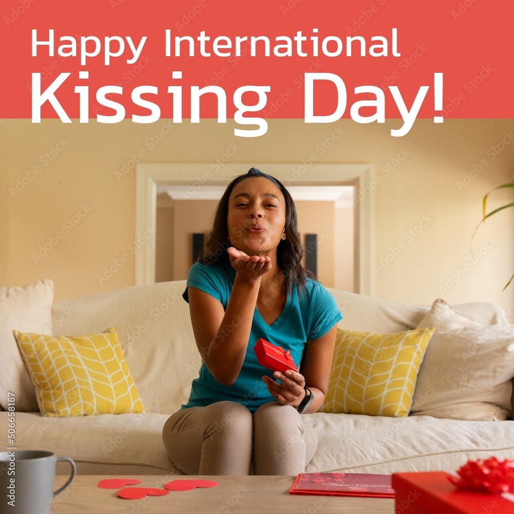 Composite of portrait of biracial young woman blowing kiss and happy international kissing day text