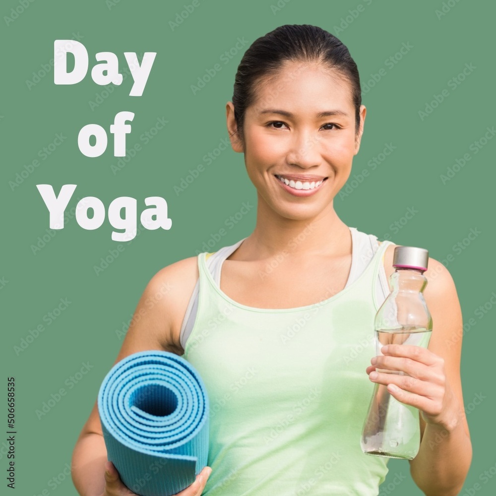 Composite of portrait of smiling asian woman holding exercise mat and bottle with day of yoga text