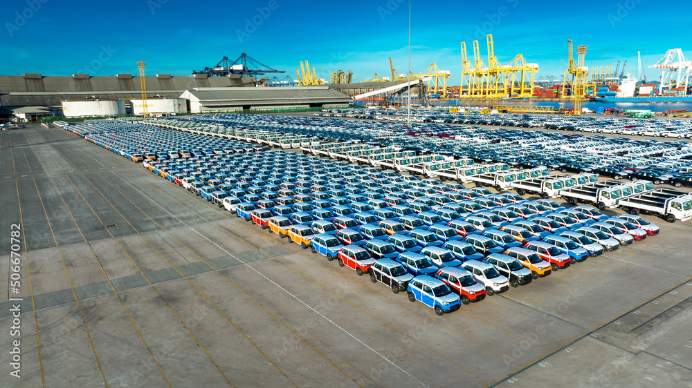 Aerial view a lot of new car for import and export shipping by ship , Smart dealership at car depot,