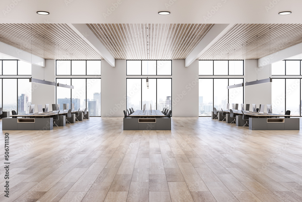 Side view on sunny open space office with rows of workspaces made from wooden tables and chairs on w