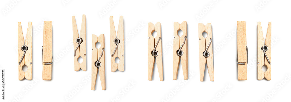 Many wooden clothespins isolated on white