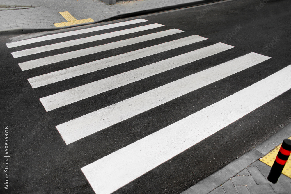 Pedestrian crossing on new asphalt road