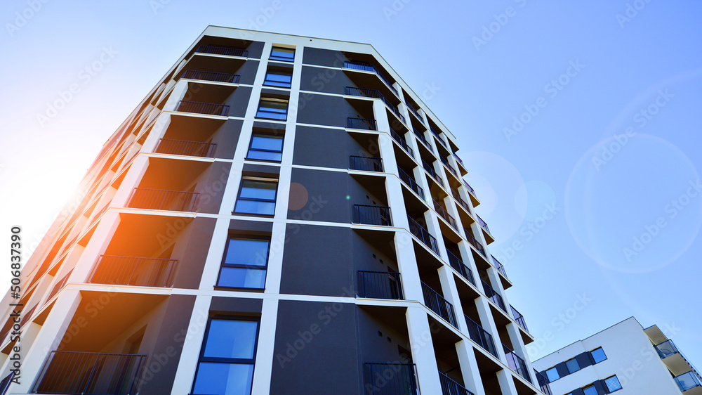 Apartment residential house and home facade architecture and outdoor facilities. Blue sky on the bac