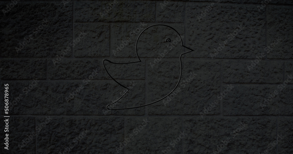 Image of glowing neon bird icon on brick wall