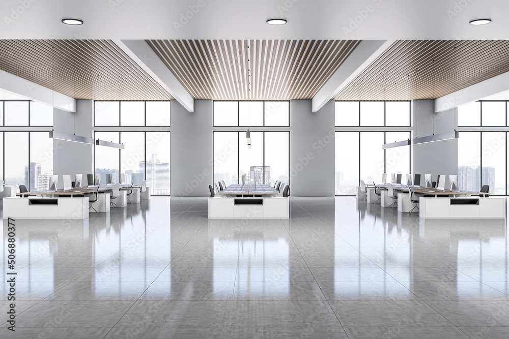 Side view on sunny open space office with rows of stylish workspaces made from white furniture on gl