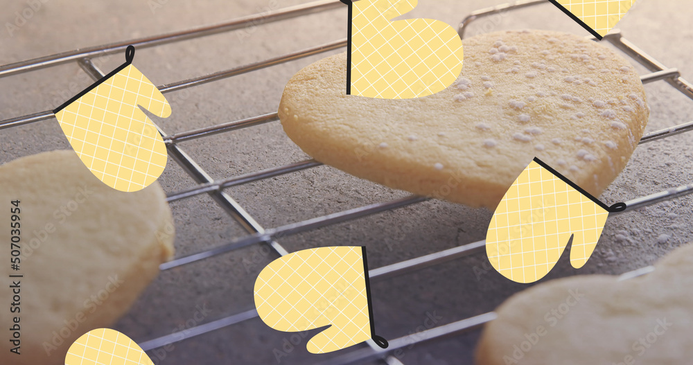 Image of baking gloves over cookies on crate