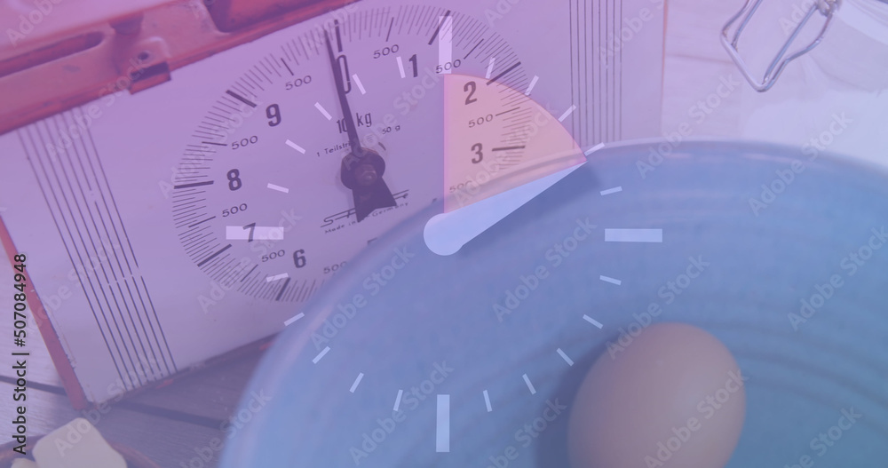 Image of clock over timer and eggs