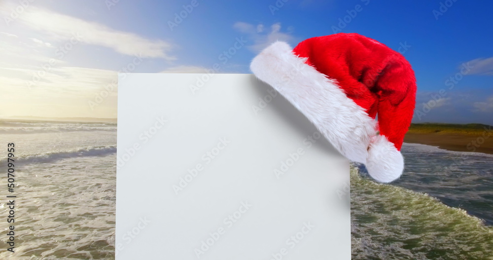 Santa hat with white card and sea