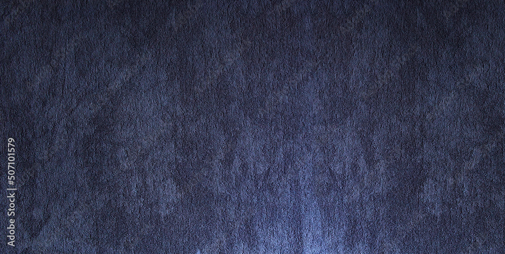 Texture of the dark blue carpet pattern background.