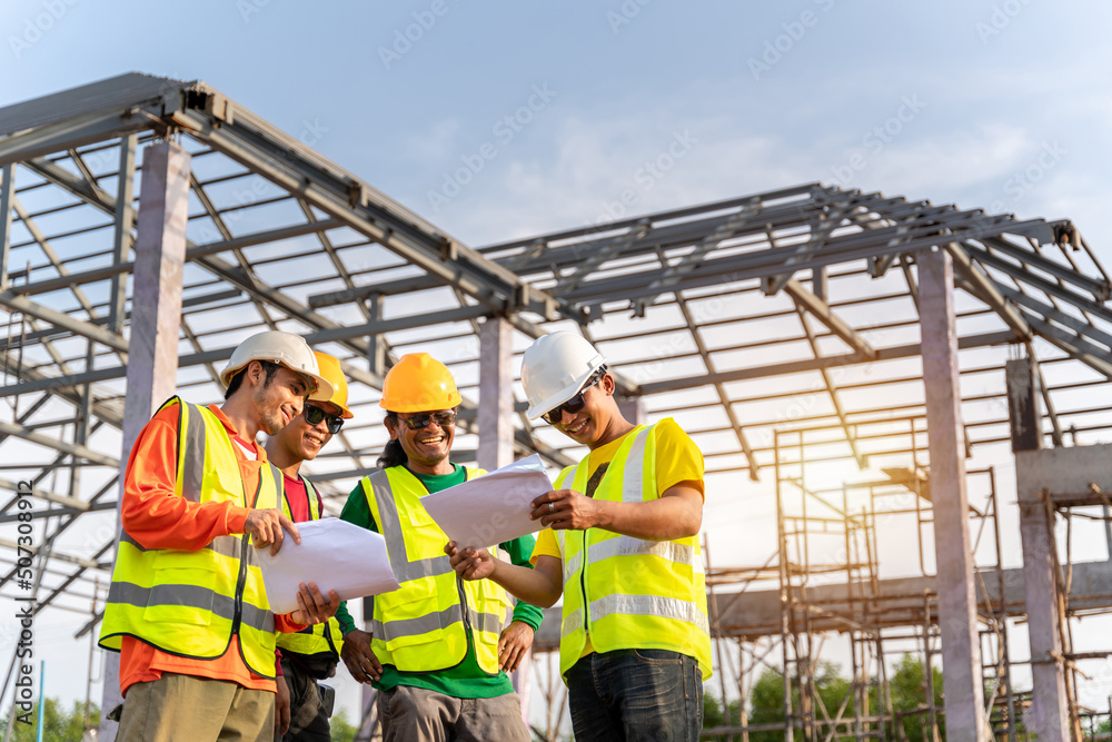 4 Workers in Construction Site, Architect Engineer technician Workers  use blue print Planing togeth