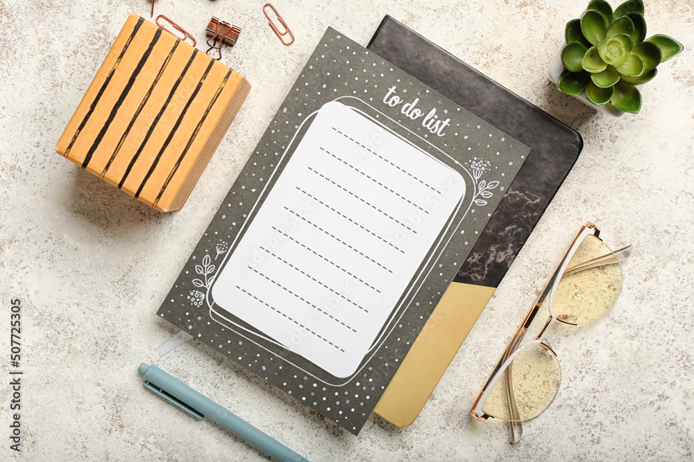 Blank to do list, stationery and eyeglasses on light background