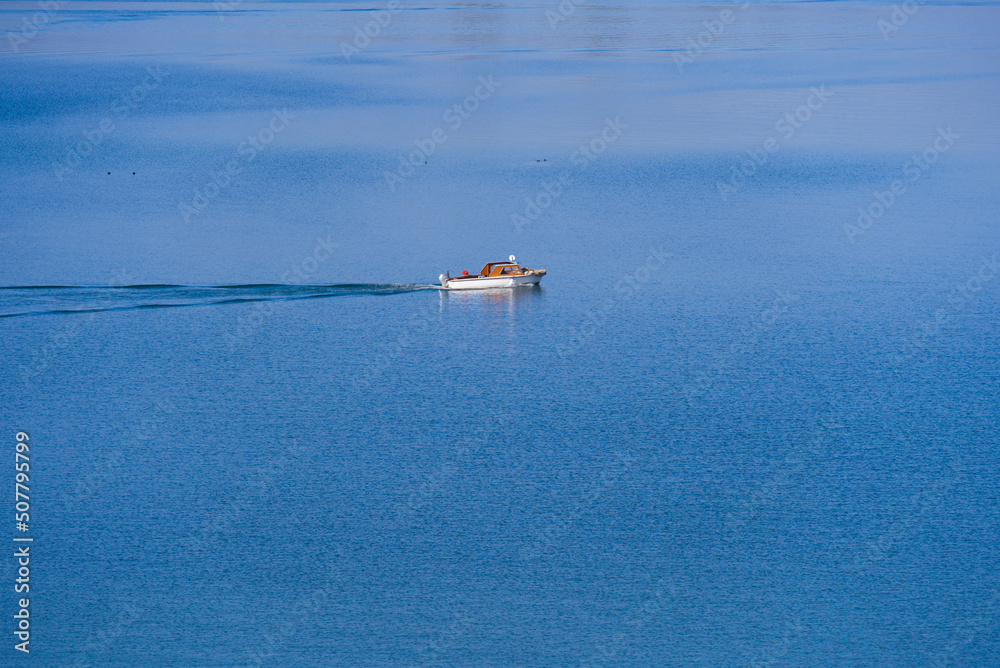 Lake Zürich with fishing boat on a sunny spring day. Photo taken April 28th, 2022, Rapprswil-Jona, S