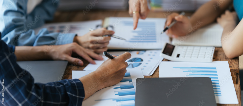 Group of business people meeting together Pointing to the graph assess business profits, Business Co